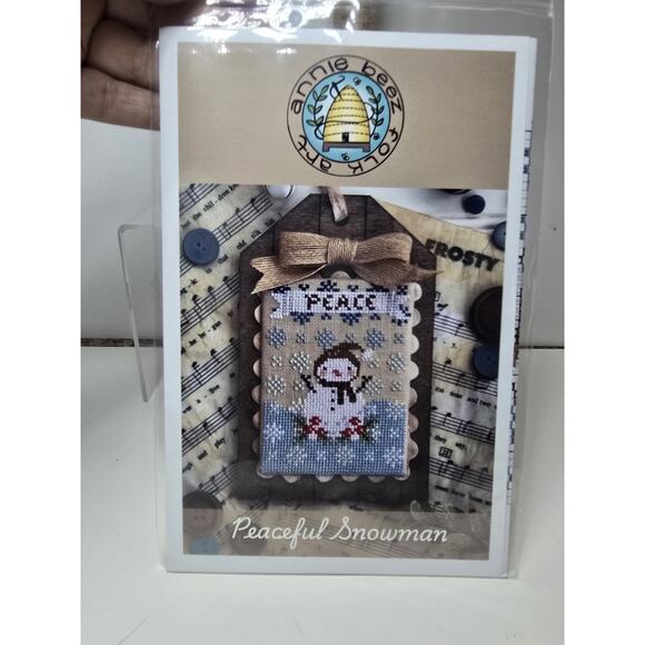 Peaceful Snowman Annie Beez Folk Art Cross Stitch Pattern Chart - Picture 1 of 2